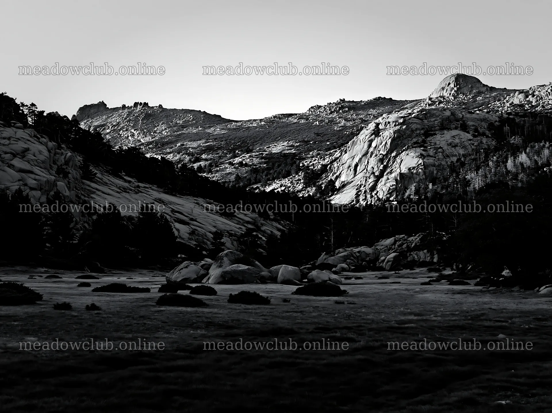 Meadow beneath crags with rocky hills in black and white – meadow photos 9174x6866