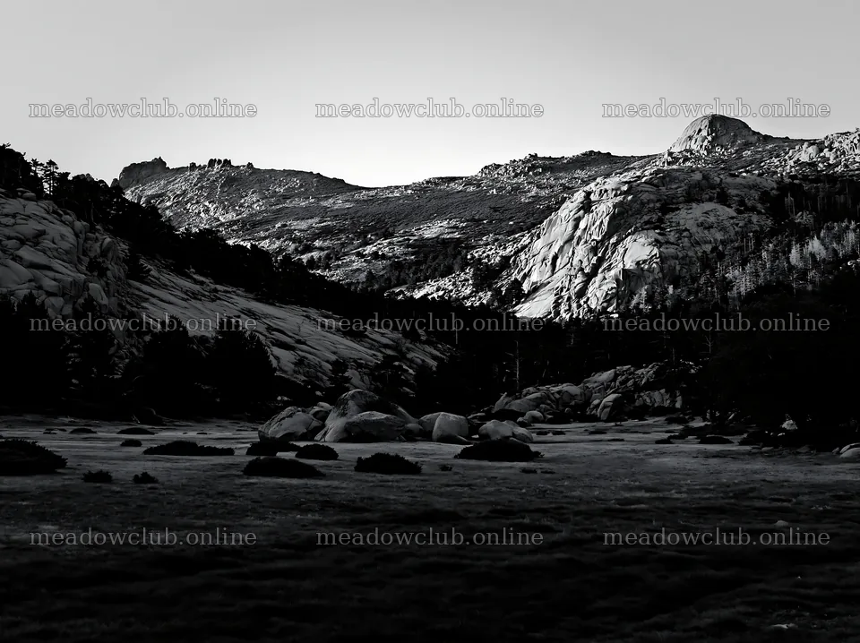 Meadow beneath crags with rocky hills in black and white – meadow photos 9174x6866