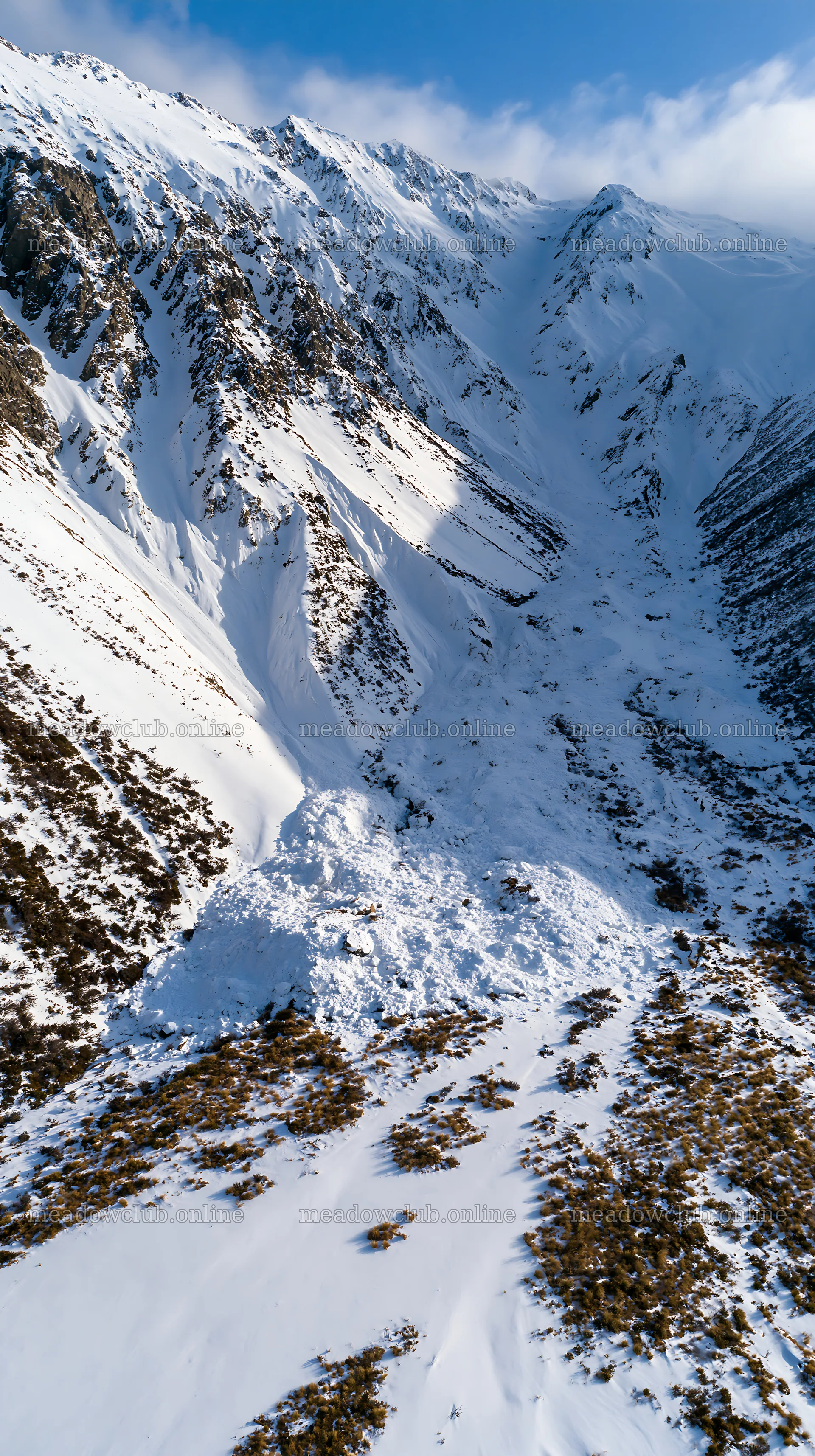 Aerial view of snowy meadow valley in mountain landscape – meadow photos 5938x10608