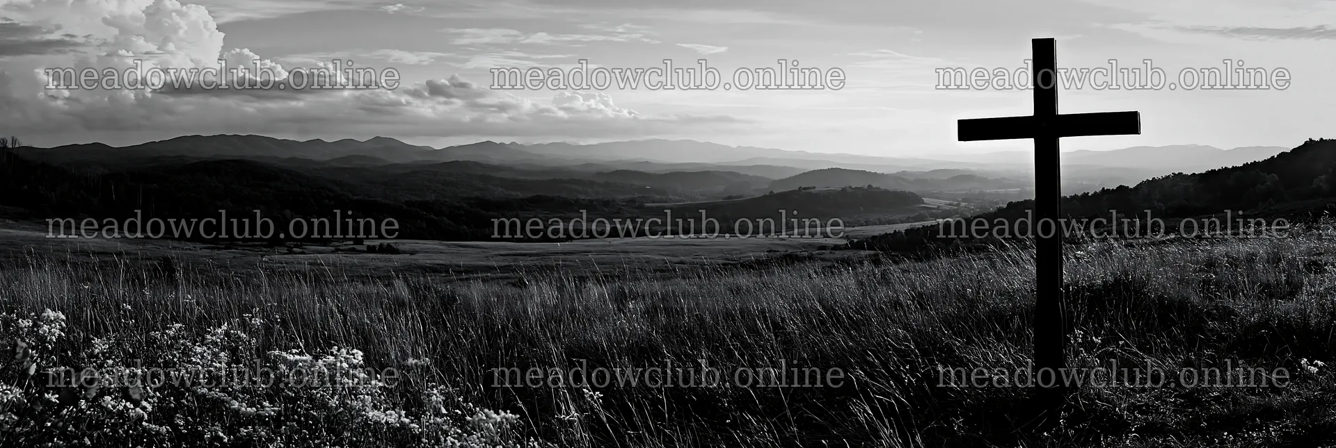Iron Christian cross overlooking valley meadow in black and white – meadow photos 13690x4602