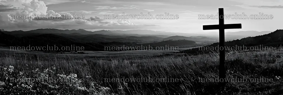 Iron Christian cross overlooking valley meadow in black and white – meadow photos 13690x4602