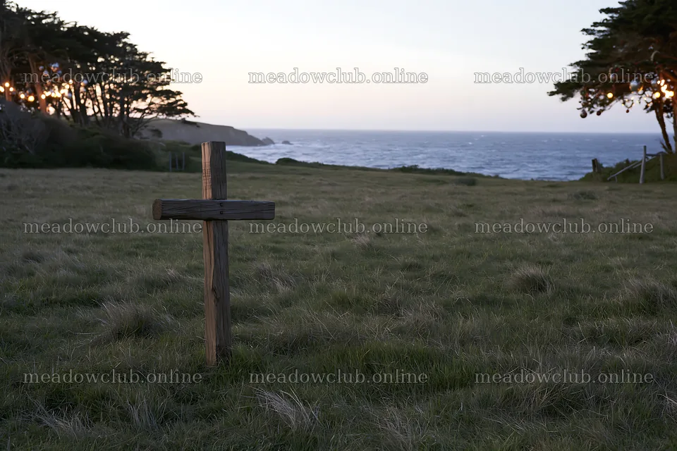 Christian cross in a meadow near the ocean at sunset – meadow photos 9722x6480