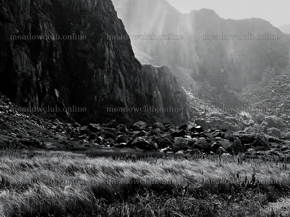 Meadow below crags with rocks and grass in black and white – meadow photos 9174x6866