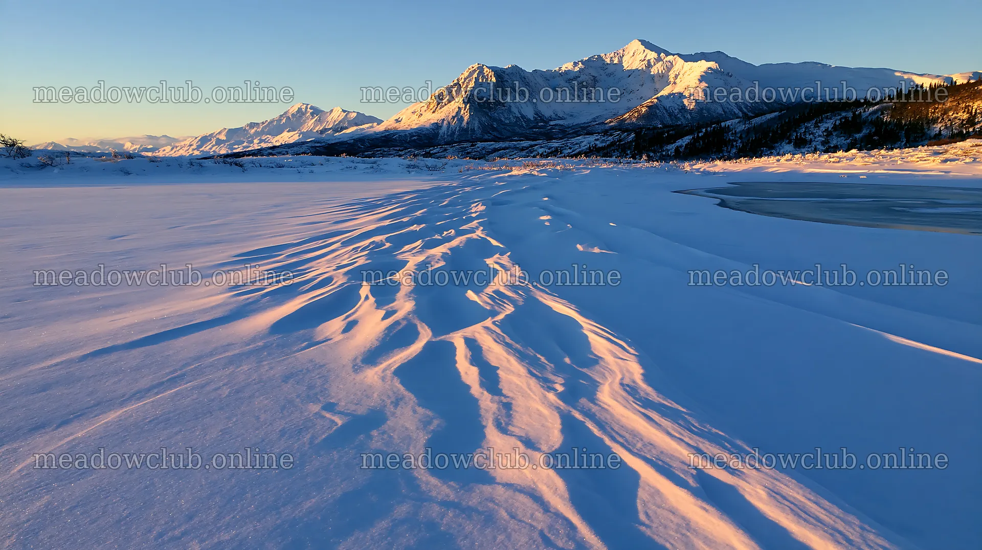 Snowbound meadow under sunlight with mountains in the distance – meadow photos 10608x5938